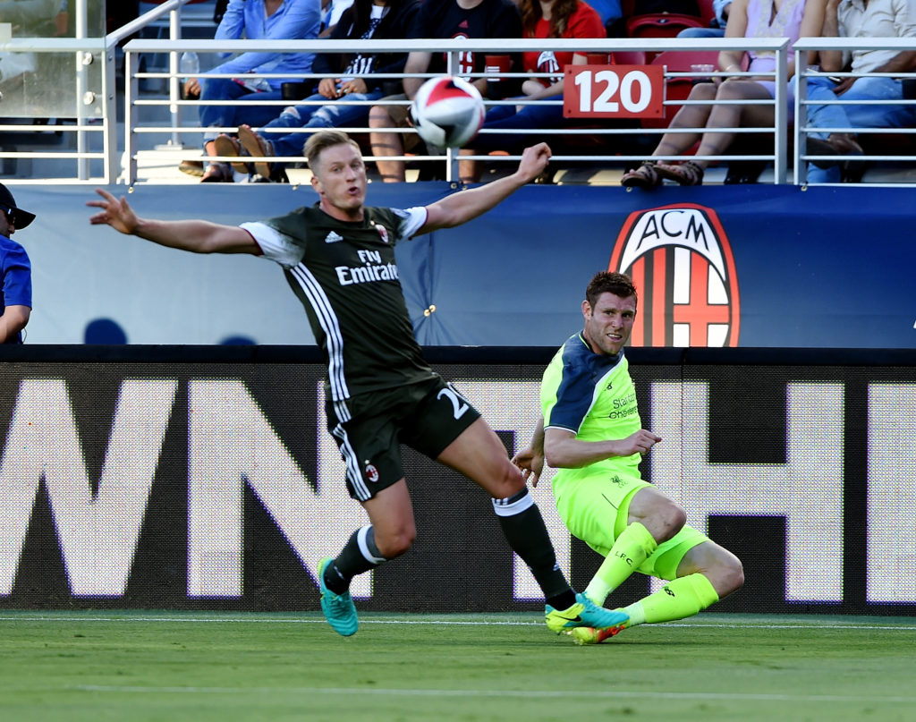 James Milner competes with AC Milan's Ignazio Abate during a pre-season game in California.  (Photo by Andrew Powell/Liverpool FC via Getty Images)