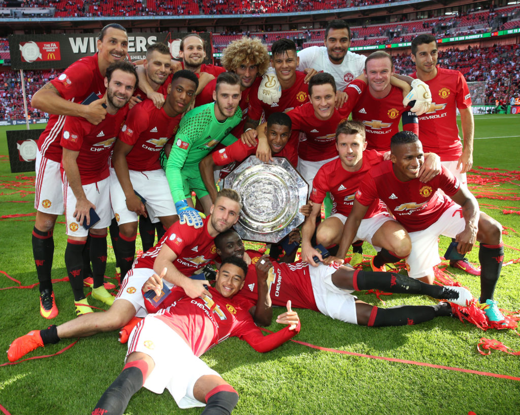 LONDON, ENGLAND - AUGUST 07:  The Manchester United squad pose with the Community Shield trophy after the FA Community Shield match between Leicester City and Manchester United at Wembley Stadium on August 7, 2016 in London, England.  (Photo by John Peters/Man Utd via Getty Images)