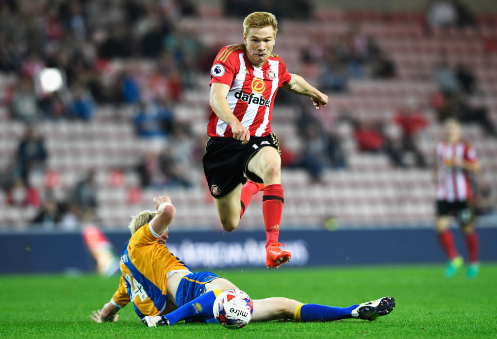 SUNDERLAND, ENGLAND - AUGUST 24: Duncan Watmore of Sunderland jumps a challenge by Ryan McGivern of Shrewsbury Town during the EFL Cup second round match between Sunderland and Shrewsbury Town at Stadium of Light on August 24, 2016 in Sunderland, England. (Photo by Stu Forster/Getty Images)