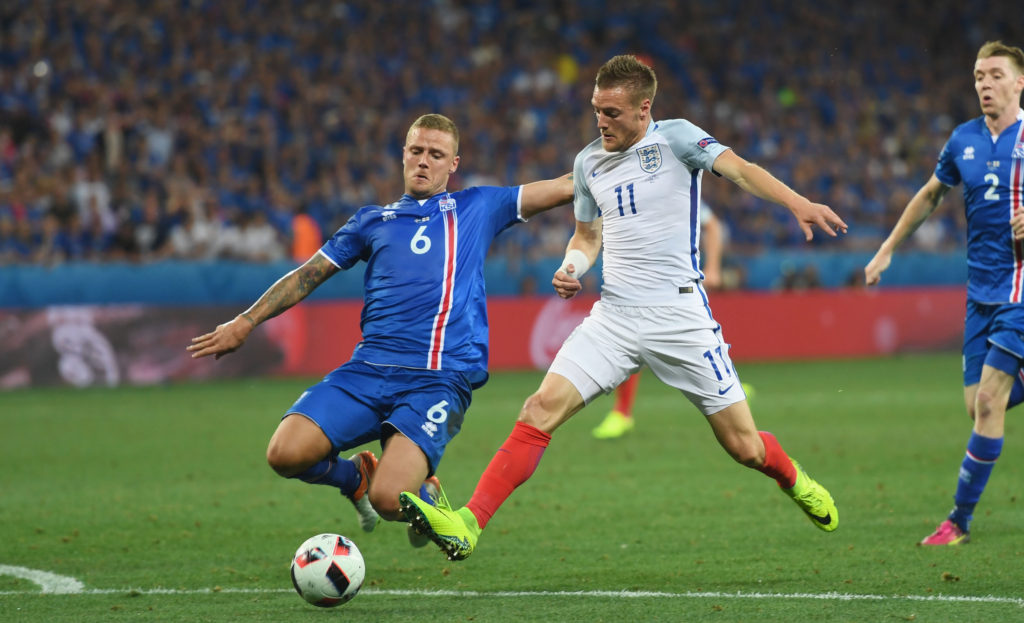 NICE, FRANCE - JUNE 27: Ragnar Sigurdsson of Iceland tackles Jamie Vardy of England during the UEFA EURO 2016 round of 16 match between England and Iceland at Allianz Riviera Stadium on June 27, 2016 in Nice, France. (Photo by Michael Regan - The FA/The FA via Getty Images)