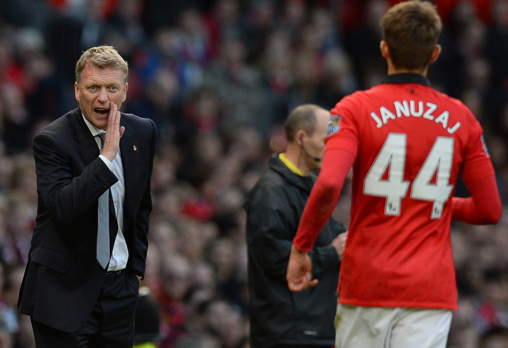 Manchester United Scottish manager David Moyes (L) speaks to Manchester United's Belgium midfielder Adnan Januzaj (R) during the English Premier League football match between Manchester United and Stoke City at Old Trafford in Manchester, northwest England on October 26, 2013. Manchester United won 3-2. AFP PHOTO/ANDREW YATES RESTRICTED TO EDITORIAL USE. No use with unauthorized audio, video, data, fixture lists, club/league logos or live services. Online in-match use limited to 45 images, no video emulation. No use in betting, games or single club/league/player publications. (Photo credit should read ANDREW YATES/AFP/Getty Images)