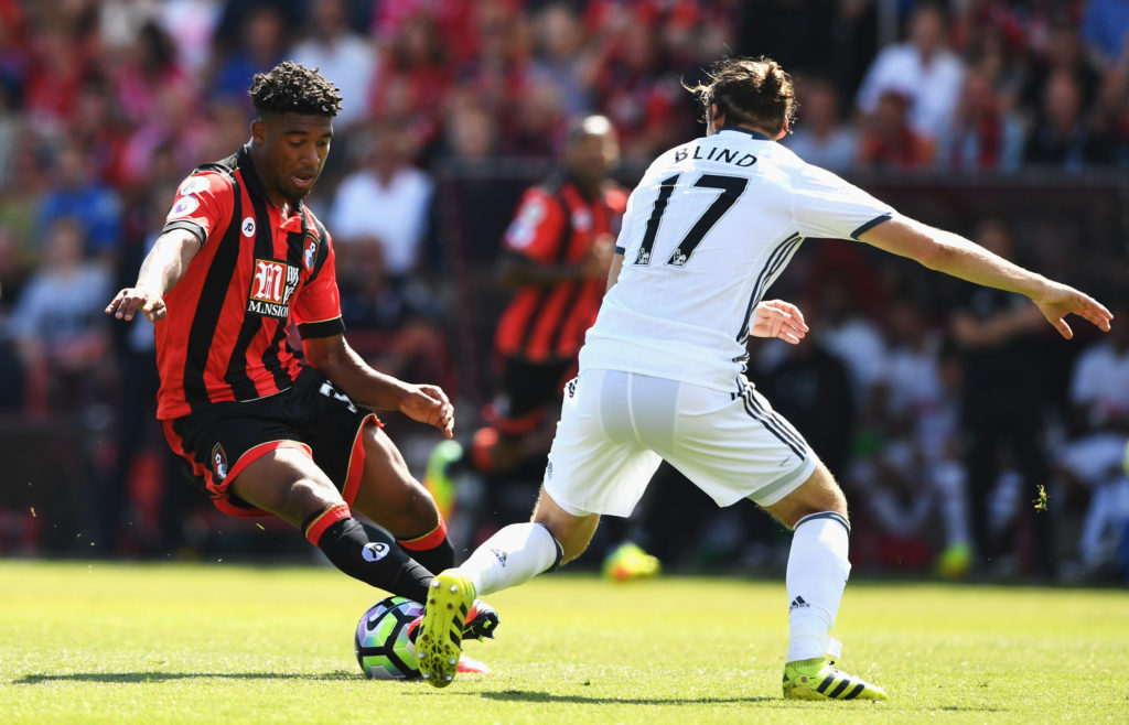 BOURNEMOUTH, ENGLAND - AUGUST 14: Jordan Ibe of AFC Bournemouth is tackled by Daley Blind of Manchester United during the Premier League match between AFC Bournemouth and Manchester United at Vitality Stadium on August 14, 2016 in Bournemouth, England. (Photo by Stu Forster/Getty Images)