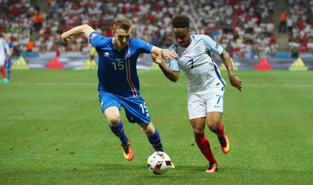 NICE, FRANCE - JUNE 27: Raheem Sterling of England and Jon Dadi Bodvarsson of Iceland compete for the ball during the UEFA EURO 2016 round of 16 match between England and Iceland at Allianz Riviera Stadium on June 27, 2016 in Nice, France. (Photo by Alex Livesey/Getty Images)
