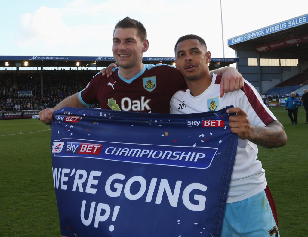 BURNLEY, UNITED KINGDOM - MAY 02:  Sam Vokes (9) and Andre Gray of Burnley (7) celebrate as they are promoted to the Premier League after the Sky Bet Championship match between Burnley and Queens Park Rangers at Turf Moor on May 2, 2016 in Burnley, United Kingdom. Burnley defeated QPR 1-0 to gain promotion.  (Photo by Jan Kruger/Getty Images)