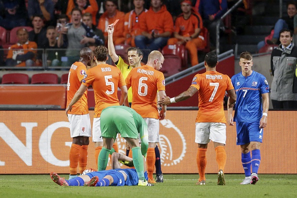 (L-R) Bruno Martins Indi of Holland, Daley Blind  of Holland, Kolbeinn Sighorsson of Iceland, goalkeeper Jasper Cillessen of Holland, referee Milorad Mazic, Davy Klaassenof Holland, Memphis Depay of Holland, Johann Berg Gudmundsson of Iceland during the UEFA Euro 2016 qualifying match between Netherlands and Iceland on September 3, 2015 at the Amsterdam Arena in Amsterdam, The Netherlands.(Photo by VI Images via Getty Images)