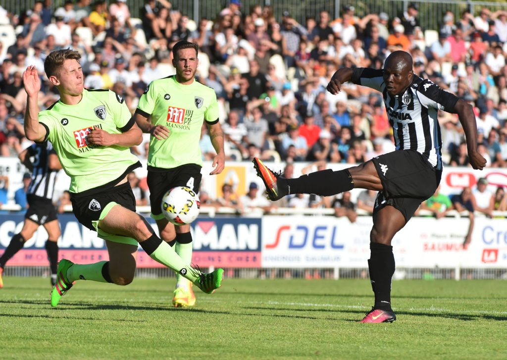 Angers' French forward Dickson Nwakaeme (R) strikes despite Bournemouth's English midfielder Corey Jordan  (L) during the International friendly football match between Angers (SCO) and Bournemouth (AFC) on August 6, 2016, in Stadium des rives du Thouet, in Saumur, northwestern France. / AFP / JEAN-FRANCOIS MONIER        (Photo credit should read JEAN-FRANCOIS MONIER/AFP/Getty Images)