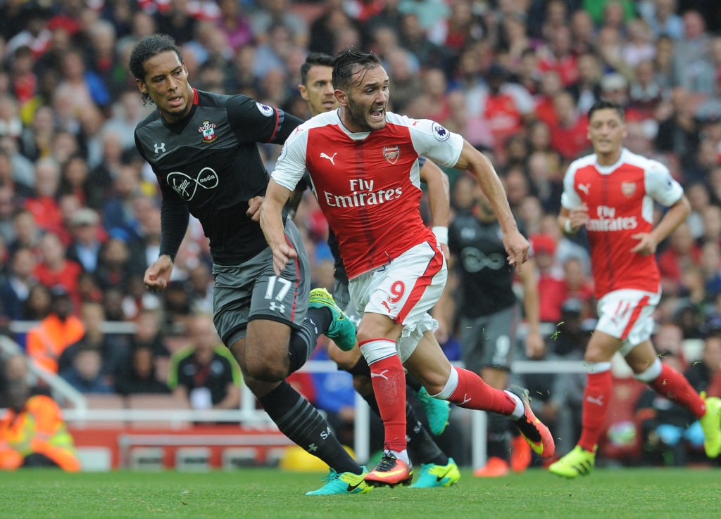 LONDON, ENGLAND - SEPTEMBER 10:  Lucas Perez of Arsenal runs with Virgil van Dijk of Southampton during the Premier League match between Arsenal and Southampton at Emirates Stadium on September 10, 2016 in London, England.  (Photo by David Price/Arsenal FC via Getty Images)