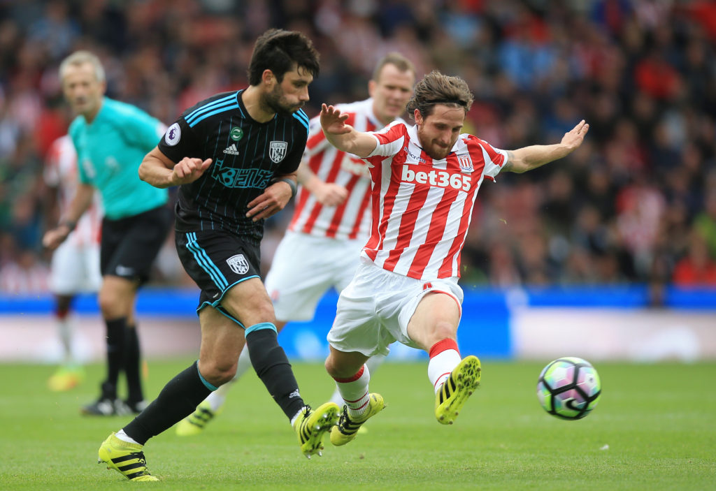 STOKE ON TRENT, ENGLAND - SEPTEMBER 24: Joe Allen of Stoke City (R) attempts to block Claudio Yacob of West Bromwich Albion (L) pass during the Premier League match between Stoke City and West Bromwich Albion at the Bet365 Stadium on September 24, 2016 in Stoke on Trent, England. (Photo by Ben Hoskins/Getty Images)