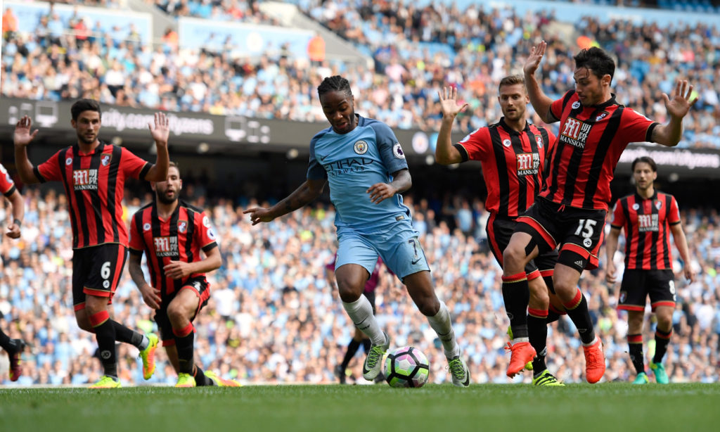 MANCHESTER, ENGLAND - SEPTEMBER 17:  Raheem Sterling of Manchester City bursts through the AFC Bournemouth defence during the Premier League match between Manchester City and AFC Bournemouth at Etihad Stadium on September 17, 2016 in Manchester, England.  (Photo by Stu Forster/Getty Images)