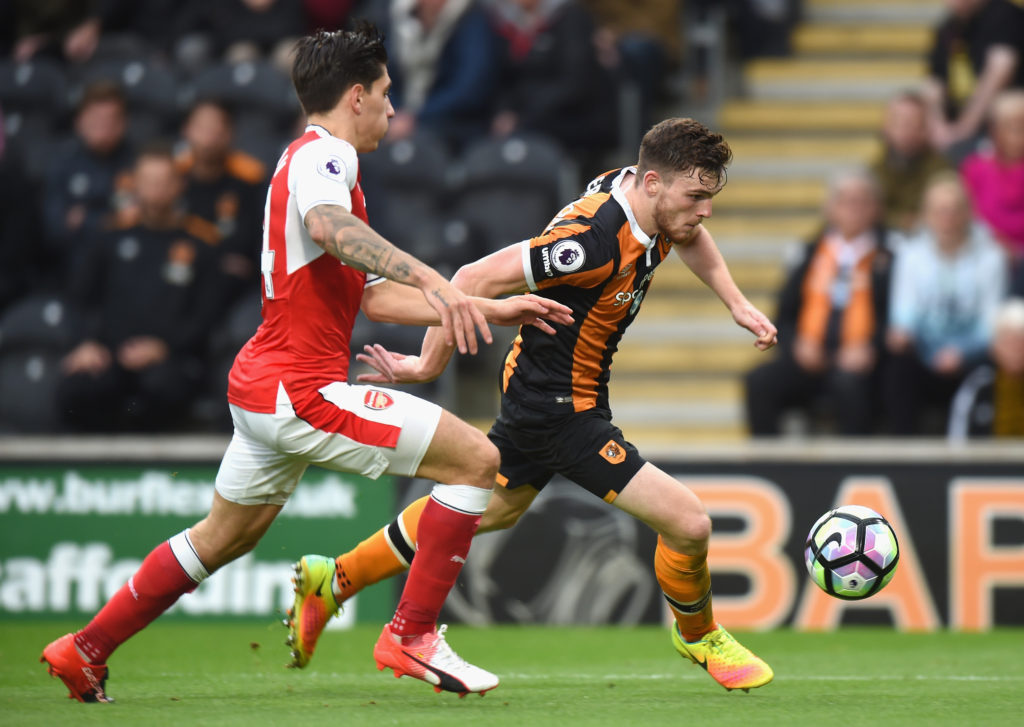 HULL, ENGLAND - SEPTEMBER 17:  Andrew Robertson of Hull City (R) is pulled back by Hector Bellerin of Arsenal (L) during the Premier League match between Hull City and Arsenal at KCOM Stadium on September 17, 2016 in Hull, England.  (Photo by Tony Marshall/Getty Images)