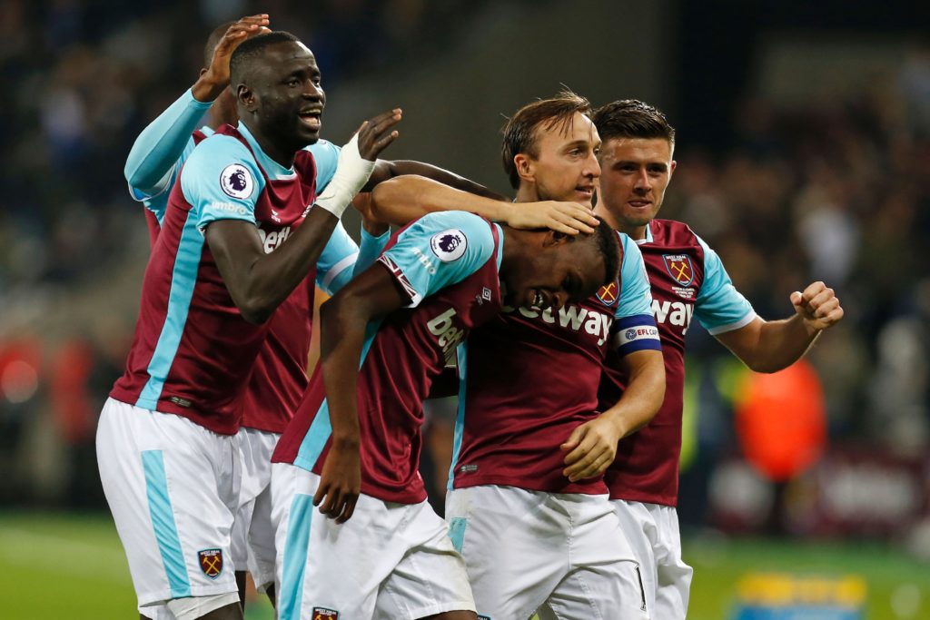 West Ham United's Swiss midfielder Edimilson Fernandes (C) celebrates with teammates after scoring their second goal during the EFL (English Football League) Cup fourth round match between West Ham United and Chelsea at The London Stadium in east London on October 26, 2016. / AFP / Ian KINGTON / RESTRICTED TO EDITORIAL USE. No use with unauthorized audio, video, data, fixture lists, club/league logos or 'live' services. Online in-match use limited to 75 images, no video emulation. No use in betting, games or single club/league/player publications.  /         (Photo credit should read IAN KINGTON/AFP/Getty Images)