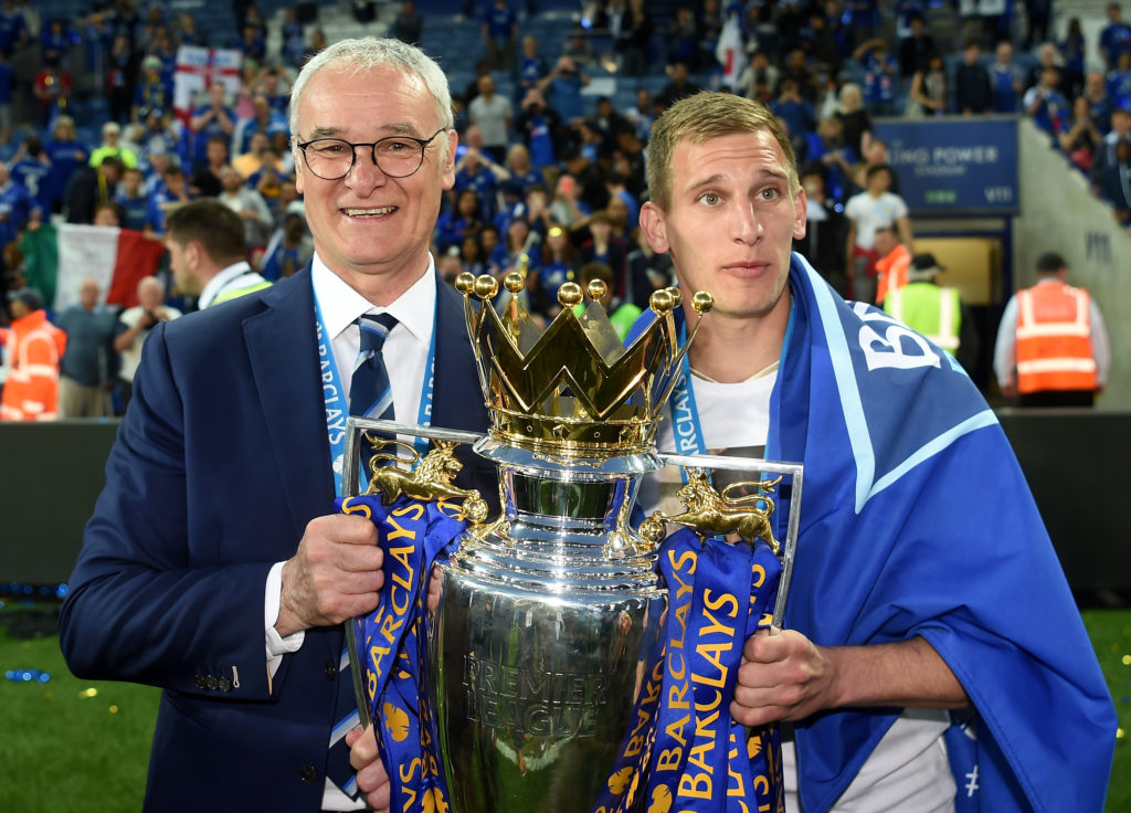 LEICESTER, ENGLAND - MAY 07: Manager Claudio Ranieri (L) and Marc Albrighton (R) of Leicester City the Premier League Trophy as players and staffs celebrate the season champion after the Barclays Premier League match between Leicester City and Everton at The King Power Stadium on May 7, 2016 in Leicester, United Kingdom. (Photo by Michael Regan/Getty Images)