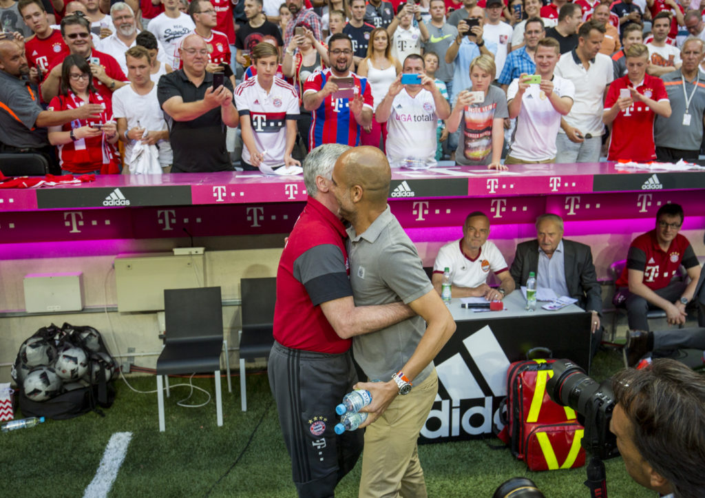 MUNICH, GERMANY - JULY 20: Trainer of Bayern Munich Carlo Ancelotti (L) and Pep Guardiola, trainer of Manchester City are seen during a friendly match between Bayern Munich and Manchester City at Allianz Arena on July 20, 2016 in Munich, Germany. (Photo by Marc Mueller/Bongarts/Getty Images)