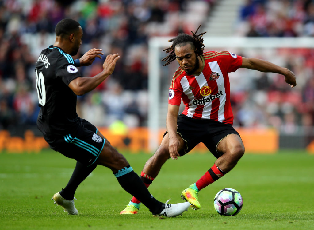SUNDERLAND, ENGLAND - OCTOBER 01: Jason Denayer of Sunderland (R) takes the ball past Matt Phillips of West Bromwich Albion (L) during the Premier League match between Sunderland and West Bromwich Albion at Stadium of Light on October 1, 2016 in Sunderland, England. (Photo by Clive Brunskill/Getty Images)
