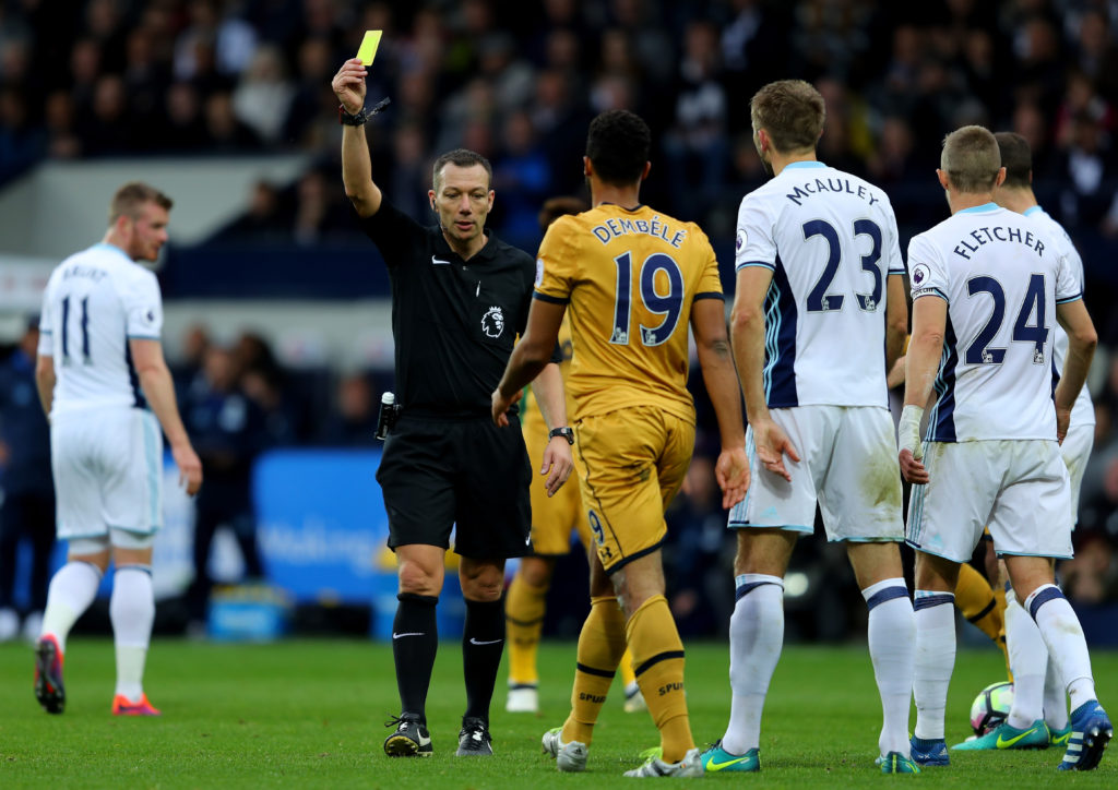WEST BROMWICH, ENGLAND - OCTOBER 15: Referee Kevin Freind (L) gives Mousa Dembele of Tottenham Hotspur (C) a yellow card for diving during the Premier League match between West Bromwich Albion and Tottenham Hotspur at The Hawthorns on October 15, 2016 in West Bromwich, England.  (Photo by Richard Heathcote/Getty Images)