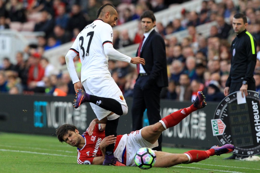 Watford's Argentinian midfielder Roberto Pereyra vies with Middlesbrough's English defender George Friend (L) during the English Premier League football match between Middlesbrough and Watford at Riverside Stadium in Middlesbrough, north east England on October 16, 2016. / AFP / Lindsey PARNABY / RESTRICTED TO EDITORIAL USE. No use with unauthorized audio, video, data, fixture lists, club/league logos or 'live' services. Online in-match use limited to 75 images, no video emulation. No use in betting, games or single club/league/player publications.  /         (Photo credit should read LINDSEY PARNABY/AFP/Getty Images)