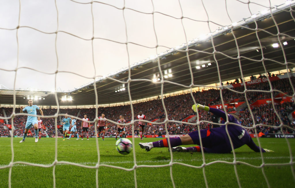 SOUTHAMPTON, ENGLAND - OCTOBER 16: Sam Vokes of Burnley scores their first goal from the penalty spot past goalkeeper Fraser Forster of Southampton during the Premier League match between Southampton and Burnley at St Mary's Stadium on October 16, 2016 in Southampton, England. (Photo by Richard Heathcote/Getty Images)