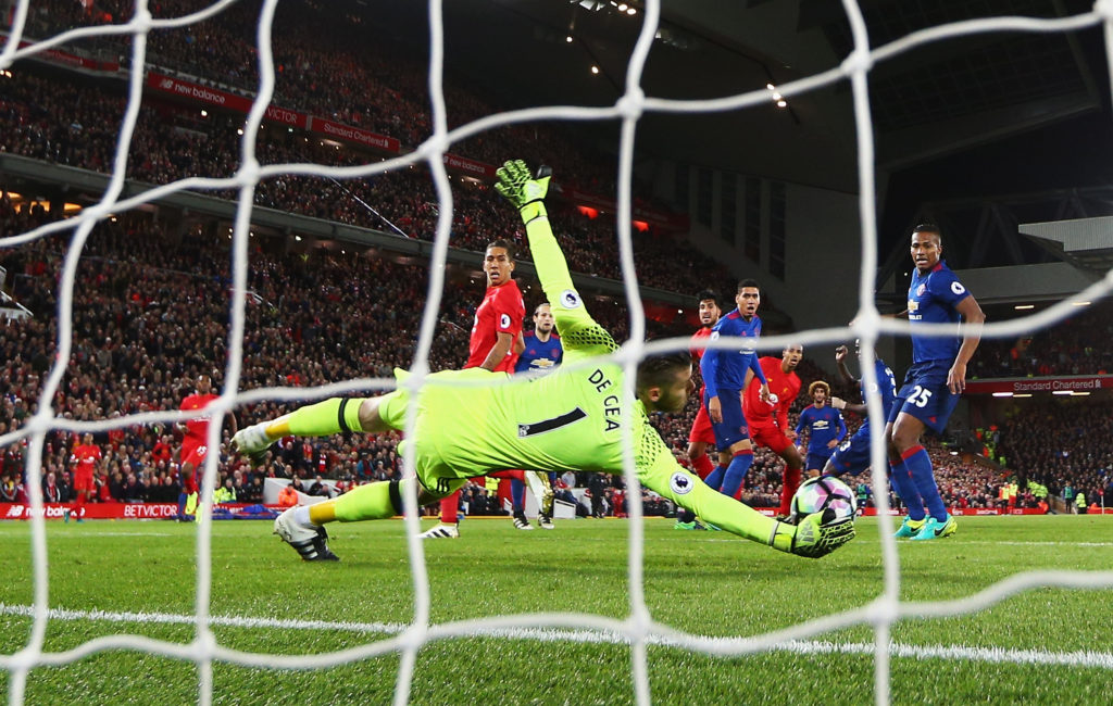 LIVERPOOL, ENGLAND - OCTOBER 17:  David De Gea of Manchester United saves from Emre Can of Liverpool during the Premier League match between Liverpool and Manchester United at Anfield on October 17, 2016 in Liverpool, England.  (Photo by Clive Brunskill/Getty Images)