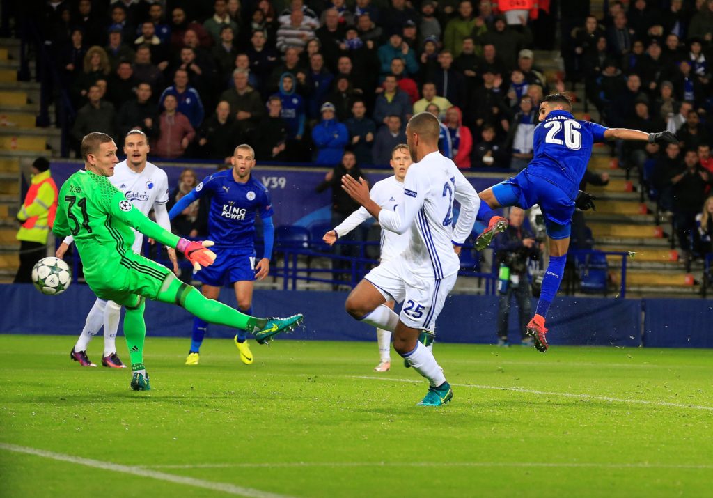 LEICESTER, UNITED KINGDOM - OCTOBER 18: Leicester City's midfielder Riyad Mahrez (R) scores the opening goal against Copenhagen during their Champions League Group G soccer match at the King Power stadium in Leicester, United Kingdom on October 18, 2016. (Photo by Lindsey Parnaby/Anadolu Agency/Getty Images)