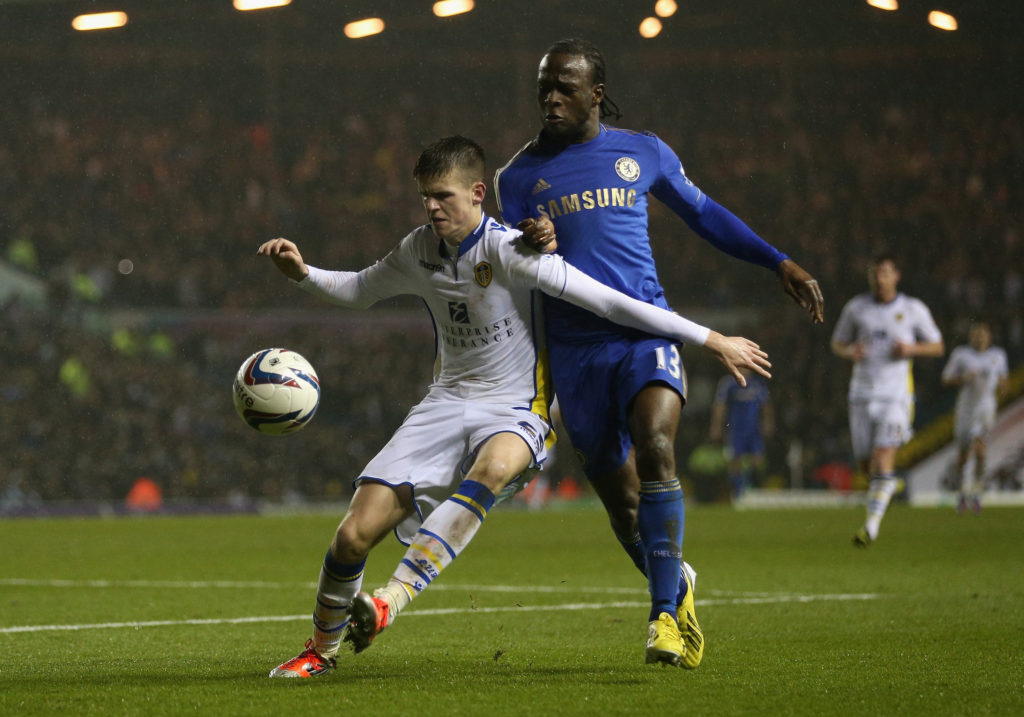 LEEDS, ENGLAND - DECEMBER 19: Sam Byram of Leeds United competes with Victor Moses of Chelsea during the Capital One Cup Quarter-Final match between Leeds United and Chelsea at Elland Road on December 19, 2012 in Leeds, England. (Photo by Clive Brunskill/Getty Images)