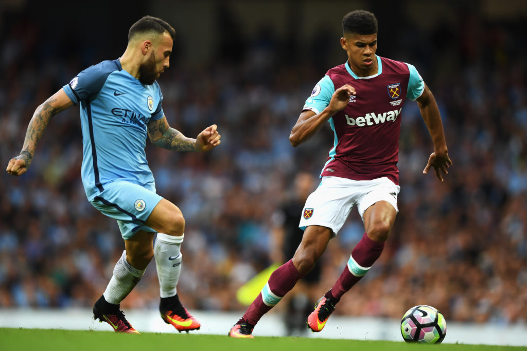MANCHESTER, ENGLAND - AUGUST 28: Ashley Fletcher of West Ham United takes on Nicolas Otamendi of Manchester City during the Premier League match between Manchester City and West Ham United at Etihad Stadium on August 28, 2016 in Manchester, England.  (Photo by Gareth Copley/Getty Images)