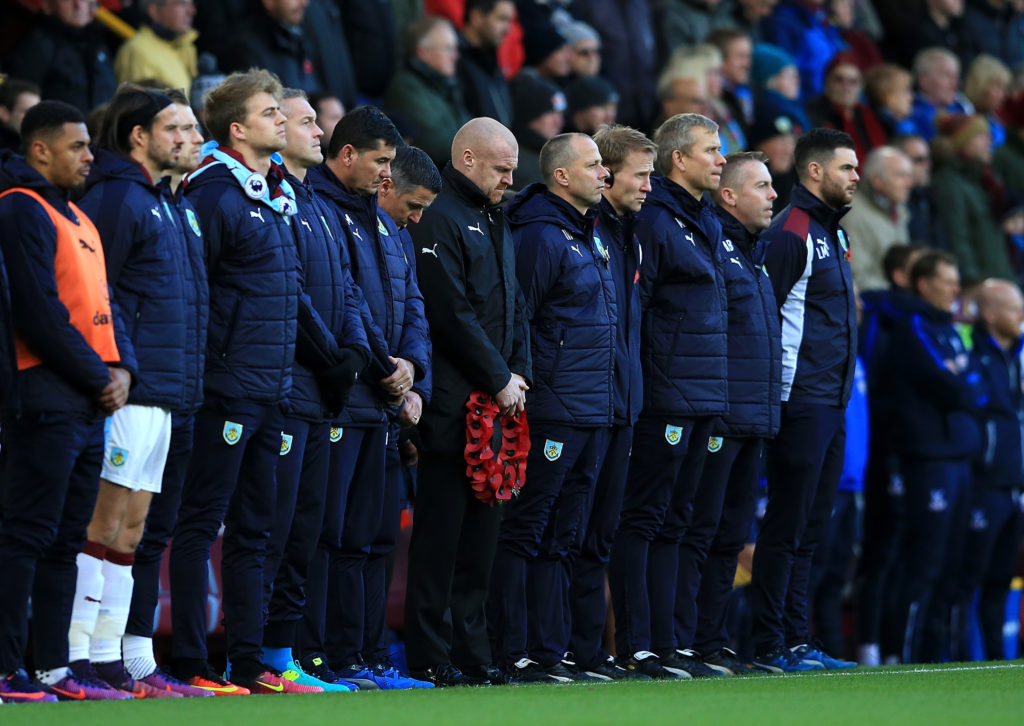 BURNLEY, ENGLAND - NOVEMBER 05:  Manager of Burnley Sean Dyche and backroom staff takes part in a minutes silence during the Premier League match between Burnley and Crystal Palace at Turf Moor on November 5, 2016 in Burnley, England.  (Photo by Jan Kruger/Getty Images)