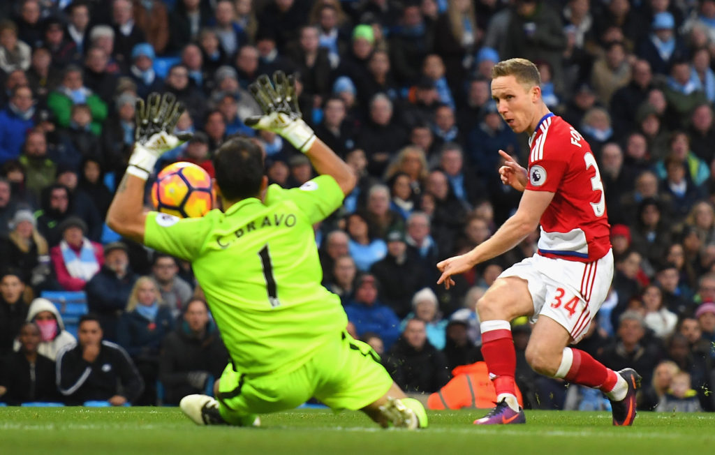 MANCHESTER, ENGLAND - NOVEMBER 05: Claudio Bravo of Manchester City (L) saves a shot from Adam Forshaw of Middlesbrough (R) during the Premier League match between Manchester City and Middlesbrough at Etihad Stadium on November 5, 2016 in Manchester, England. (Photo by Laurence Griffiths/Getty Images)