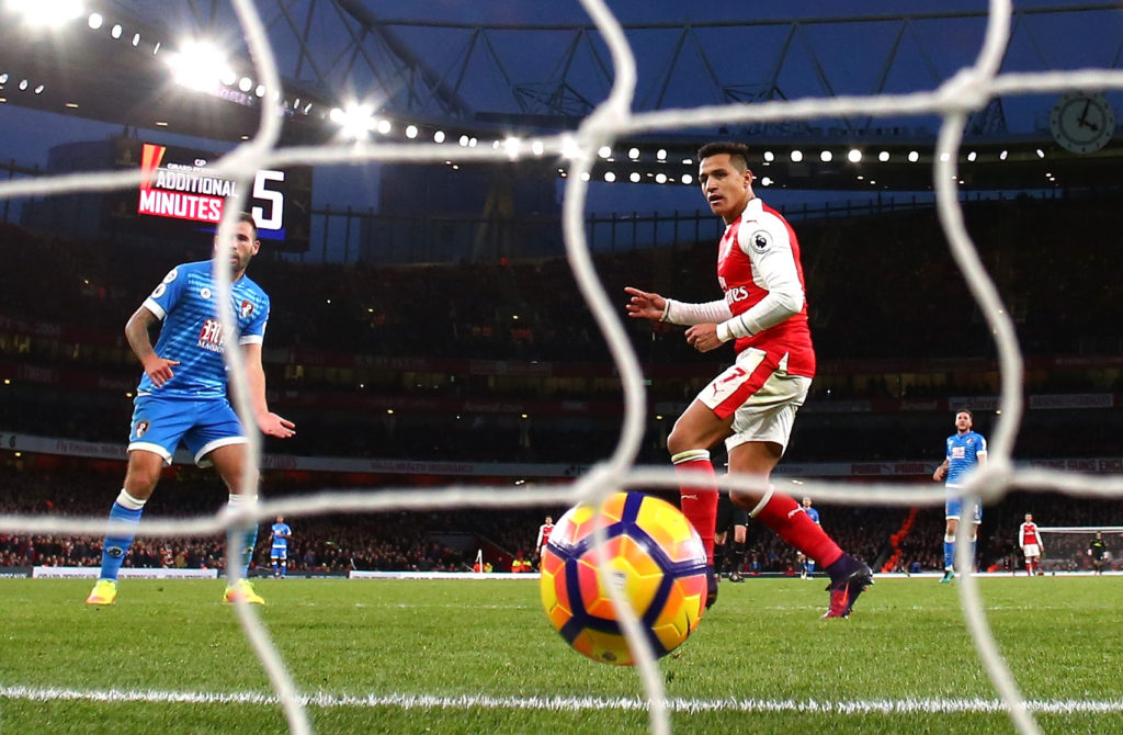 LONDON, ENGLAND - NOVEMBER 27:  Alexis Sanchez of Arsenal scores his sides third goal during the Premier League match between Arsenal and AFC Bournemouth at Emirates Stadium on November 27, 2016 in London, England.  (Photo by Clive Rose/Getty Images)