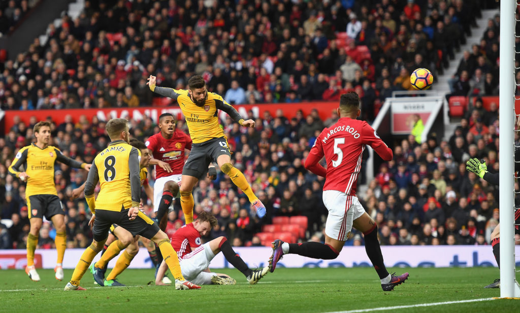 MANCHESTER, ENGLAND - NOVEMBER 19: Olivier Giroud of Arsenal (C) scores his sides first goal during the Premier League match between Manchester United and Arsenal at Old Trafford on November 19, 2016 in Manchester, England. (Photo by Michael Regan/Getty Images)