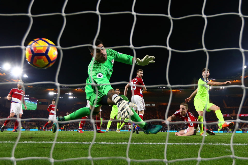 MIDDLESBROUGH, ENGLAND - DECEMBER 14: Adam Lallana (1st R) of Liverpool heads to score the opening goal past Victor Valdes of Middlesbrough during the Premier League match between Middlesbrough and Liverpool at Riverside Stadium on December 14, 2016 in Middlesbrough, England. (Photo by Jan Kruger/Getty Images)