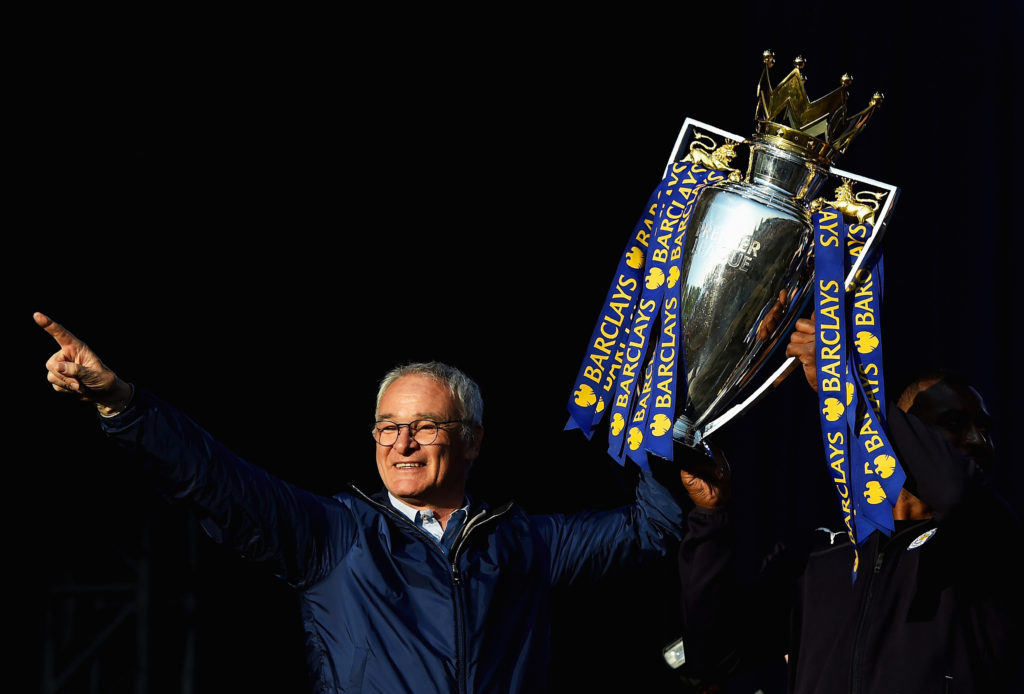 LEICESTER, ENGLAND - MAY 16:  (L-R) Claudio Ranieri Manager of Leicester City and captain Wes Morgan of Leicester City show the trophy to the fans during the Leicester City Barclays Premier League winners bus parade on May 16, 2016 in Leicester, England.  (Photo by Laurence Griffiths/Getty Images)