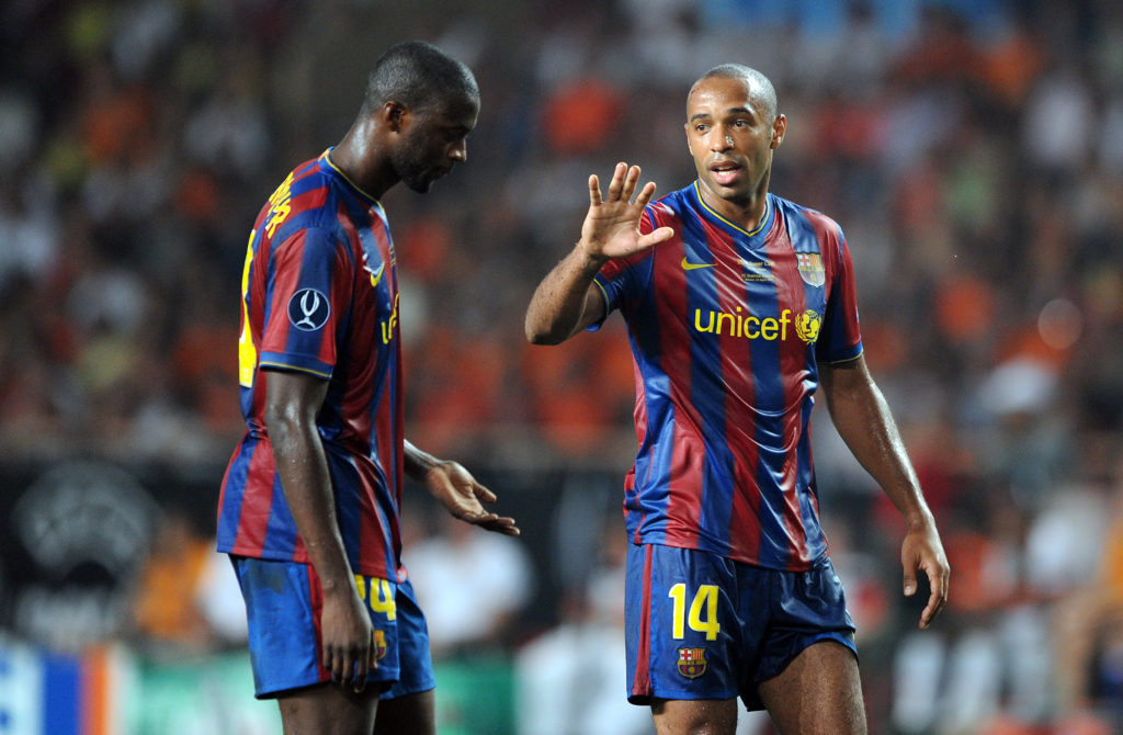 Thierry Henry of Barcelona makes a point to team-mate Yaya Toure (Photo by Chris Brunskill Ltd/Corbis via Getty Images)