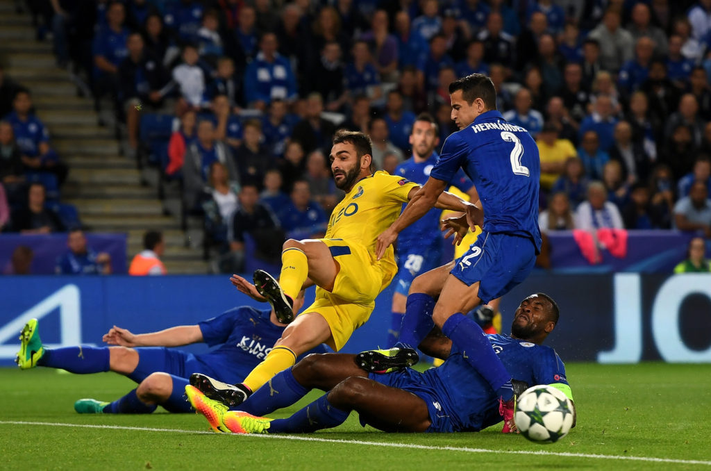 LEICESTER, ENGLAND - SEPTEMBER 27: Adrian Lopez of FC Porto is challenged by Luis Hernandez (20) and Wes Morgan of Leicester City during the UEFA Champions League Group G match between Leicester City FC and FC Porto at The King Power Stadium on September 27, 2016 in Leicester, England. (Photo by Michael Regan/Getty Images)