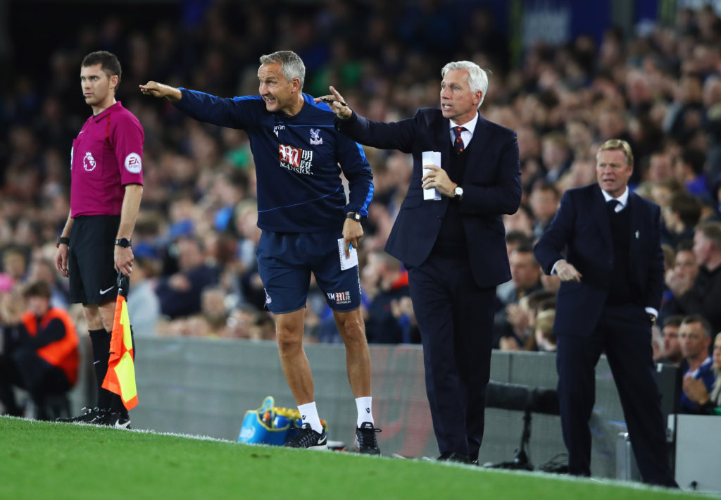 LIVERPOOL, ENGLAND - SEPTEMBER 30:  Alan Pardew manager of Crystal Palace (C) and assistance manager Keith Millen signal as Ronald Koeman manager of Everton (R) looks on during the Premier League match between Everton and Crystal Palace at Goodison Park on September 30, 2016 in Liverpool, England.  (Photo by Clive Brunskill/Getty Images)