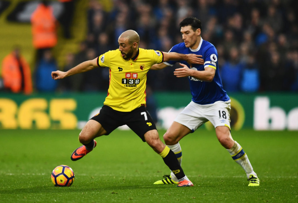 WATFORD, ENGLAND - DECEMBER 10: Nordin Amrabat of Watford holds off Gareth Barry of Everton during the Premier League match between Watford and Everton at Vicarage Road on December 10, 2016 in Watford, England. (Photo by Dan Mullan/Getty Images)