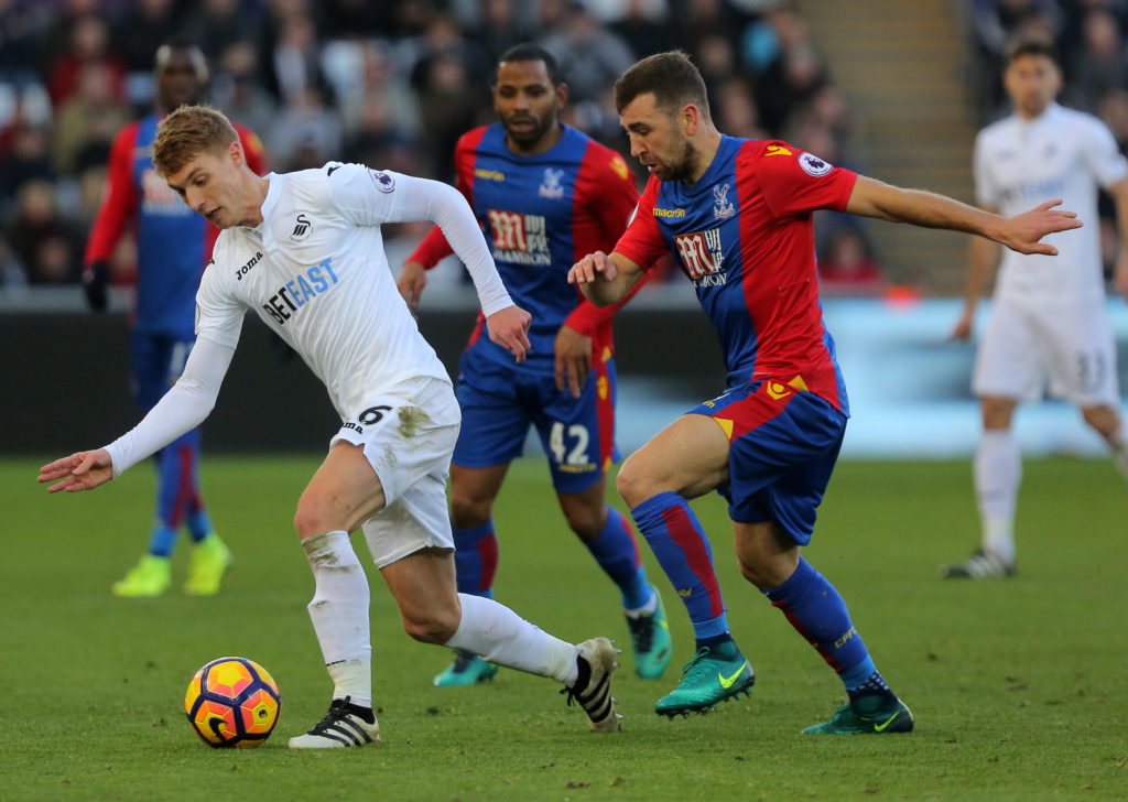 SWANSEA, WALES - NOVEMBER 26: (L-R) Jay Fulton of Swansea City against James McArthur of Crystal Palace during the Premier League match between Swansea City and Crystal Palace at The Liberty Stadium on November 26, 2016 in Swansea, Wales. (Photo by Athena Pictures/Getty Images)