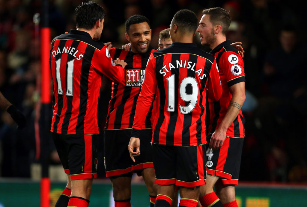 BOURNEMOUTH, ENGLAND - JANUARY 03: Callum Wilson of Bournemouth celebrates with his team mates after he scores a goal to make it 2-0 during the Premier League match between AFC Bournemouth and Arsenal at Vitality Stadium on January 3, 2017 in Bournemouth, England. (Photo by Catherine Ivill - AMA/Getty Images)