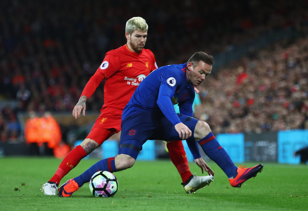 LIVERPOOL, ENGLAND - OCTOBER 17: Wayne Rooney of Manchester United is challenged by Alberto Moreno of Liverpool during the Premier League match between Liverpool and Manchester United at Anfield on October 17, 2016 in Liverpool, England. (Photo by Clive Brunskill/Getty Images)