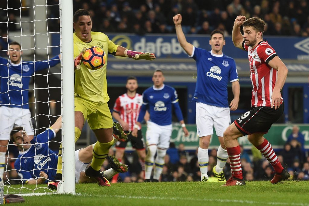 Everton's Spanish goalkeeper Joel Robles (L) saves a shot from Southampton's English striker Jay Rodriguez during the English Premier League football match between Everton and Southampton at Goodison Park in Liverpool, north west England on January 2, 2017. / AFP / Paul ELLIS / RESTRICTED TO EDITORIAL USE. No use with unauthorized audio, video, data, fixture lists, club/league logos or 'live' services. Online in-match use limited to 75 images, no video emulation. No use in betting, games or single club/league/player publications.  /         (Photo credit should read PAUL ELLIS/AFP/Getty Images)