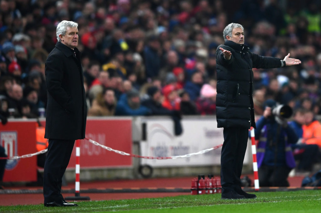 STOKE ON TRENT, ENGLAND - JANUARY 21:  Jose Mourinho manager of Manchester United reacts as Mark Hughes manager of Stoke City looks on during the Premier League match between Stoke City and Manchester United at Bet365 Stadium on January 21, 2017 in Stoke on Trent, England.  (Photo by Laurence Griffiths/Getty Images)