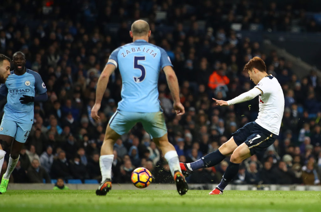 MANCHESTER, ENGLAND - JANUARY 21: Heung-Min Son of Tottenham Hotspur (R) scores his sides second goal during the Premier League match between Manchester City and Tottenham Hotspur at the Etihad Stadium on January 21, 2017 in Manchester, England.  (Photo by Clive Mason/Getty Images)