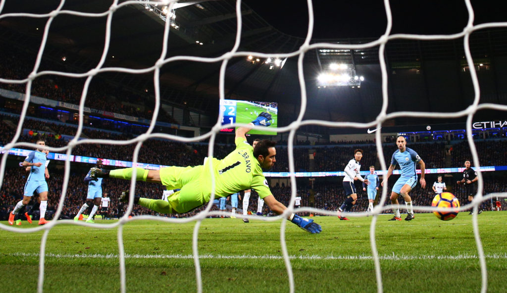 MANCHESTER, ENGLAND - JANUARY 21:  Heung-Min Son of Tottenham Hotspur scores his sides second goal past Claudio Bravo of Manchester City  during the Premier League match between Manchester City and Tottenham Hotspur at the Etihad Stadium on January 21, 2017 in Manchester, England.  (Photo by Clive Mason/Getty Images)