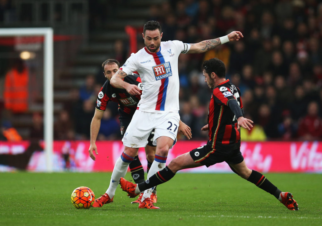 BOURNEMOUTH, ENGLAND - DECEMBER 26: Damien Delaney of Crystal Palace is closed down by Adam Smith of Bournemouth during the Barclays Premier League match between A.F.C. Bournemouth and Crystal Palace at Vitality Stadium on December 26, 2015 in Bournemouth, England.  (Photo by Steve Bardens/Getty Images)