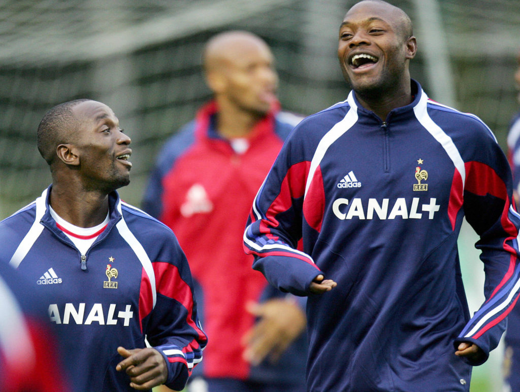 Clairefontaine-en-Yvelines, FRANCE: French football team's midfielder Claude Makelele (L) jokes with defender William Gallas during a training session, 04 October 2005 in Clairefontaine, near Paris. France will meet Switzerland in the 2006 World Cup qualifiers at the Wankdorf Stadium in Berne next 08 October. AFP PHOTO FRANCK FIFE (Photo credit should read FRANCK FIFE/AFP/Getty Images)