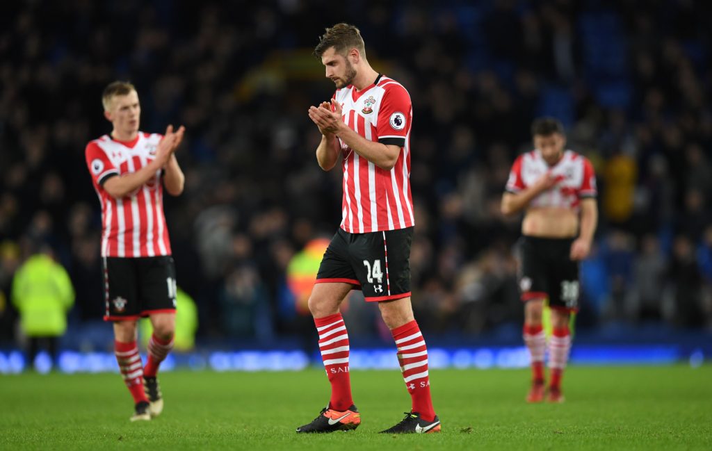 Southampton's English defender Jack Stephens (C) appluads the fans following the English Premier League football match between Everton and Southampton at Goodison Park in Liverpool, north west England on January 2, 2017. / AFP / Paul ELLIS / RESTRICTED TO EDITORIAL USE. No use with unauthorized audio, video, data, fixture lists, club/league logos or 'live' services. Online in-match use limited to 75 images, no video emulation. No use in betting, games or single club/league/player publications. / (Photo credit should read PAUL ELLIS/AFP/Getty Images)