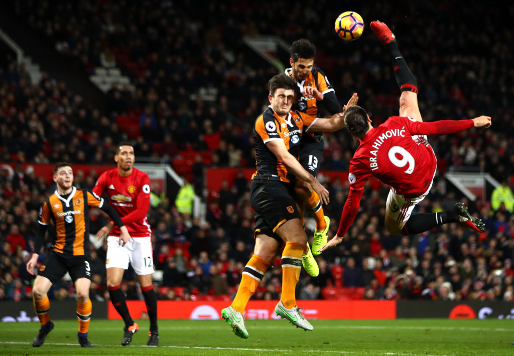MANCHESTER, ENGLAND - FEBRUARY 01:  Zlatan Ibrahimovic of Manchester United performs an acrobatic kick with Harry Maguire and Andrea Ranocchia of Hull City during the Premier League match between Manchester United and Hull City at Old Trafford on February 1, 2017 in Manchester, England.  (Photo by Clive Mason/Getty Images)