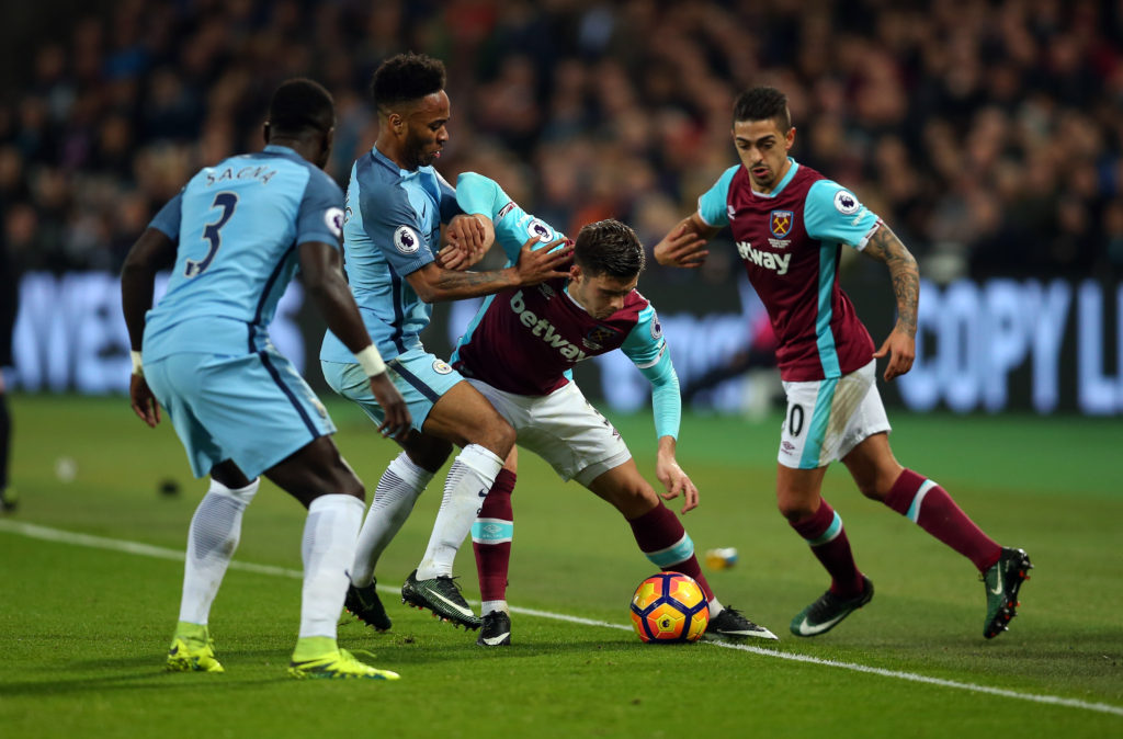 STRATFORD, ENGLAND - FEBRUARY 01: Raheem Sterling of Manchester City and Aaron Cresswell of West Ham during the Premier League match between West Ham United and Manchester City at London Stadium on February 1, 2017 in Stratford, England. (Photo by Catherine Ivill - AMA/Getty Images)