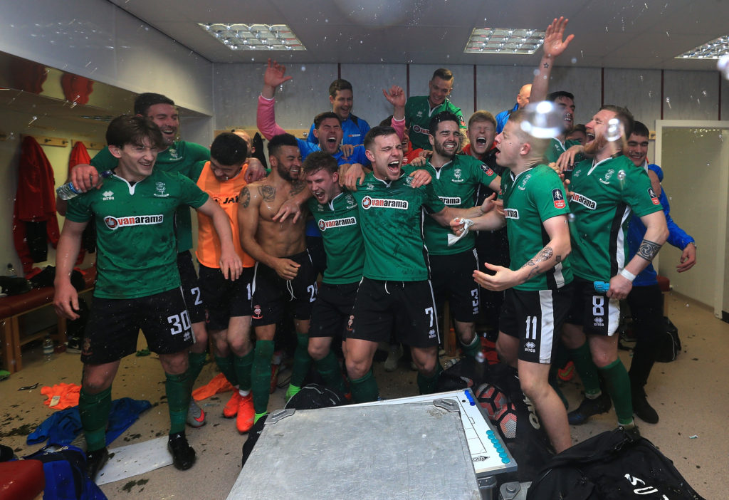 BURNLEY, ENGLAND - FEBRUARY 18:  The Lincoln City team celebrate their win in the changing room after The Emirates FA Cup Fifth Round match between Burnley and Lincoln City at Turf Moor on February 18, 2017 in Burnley, England.  (Photo by Jan Kruger/Getty Images)