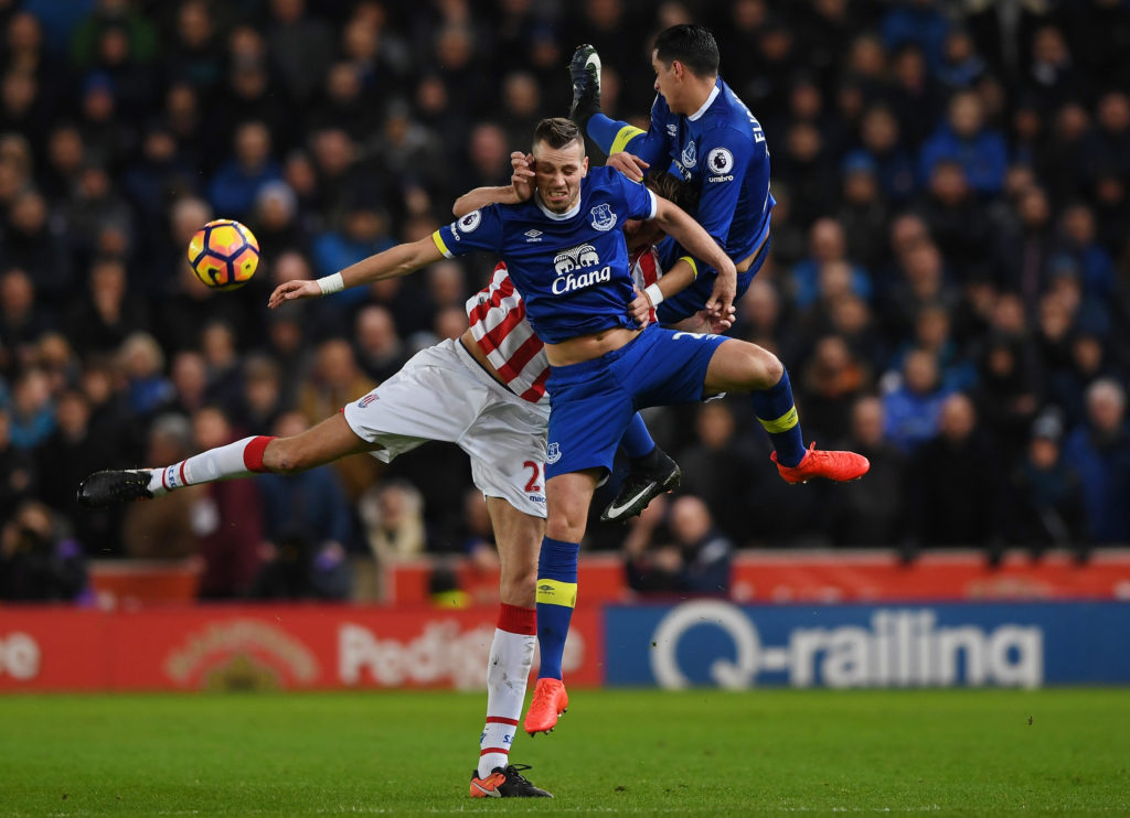 STOKE ON TRENT, ENGLAND - FEBRUARY 01:  Peter Crouch of Stoke City is challenged by Morgan Schneiderlin and Ramiro Funes Mori of Everton during the Premier League match between Stoke City and Everton at Bet365 Stadium on February 1, 2017 in Stoke on Trent, England.  (Photo by Gareth Copley/Getty Images)