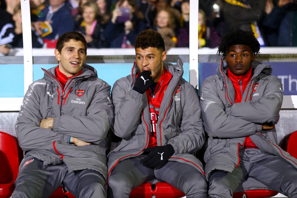 SUTTON, GREATER LONDON - FEBRUARY 20: Emiliano Martinez, Alex Oxlade-Chamberlain and Ainsley Maitland-Niles of Arsenal sit on the bench before the Emirates FA Cup fifth round match between Sutton United and Arsenal on February 20, 2017 in Sutton, Greater London. (Photo by Clive Rose/Getty Images)